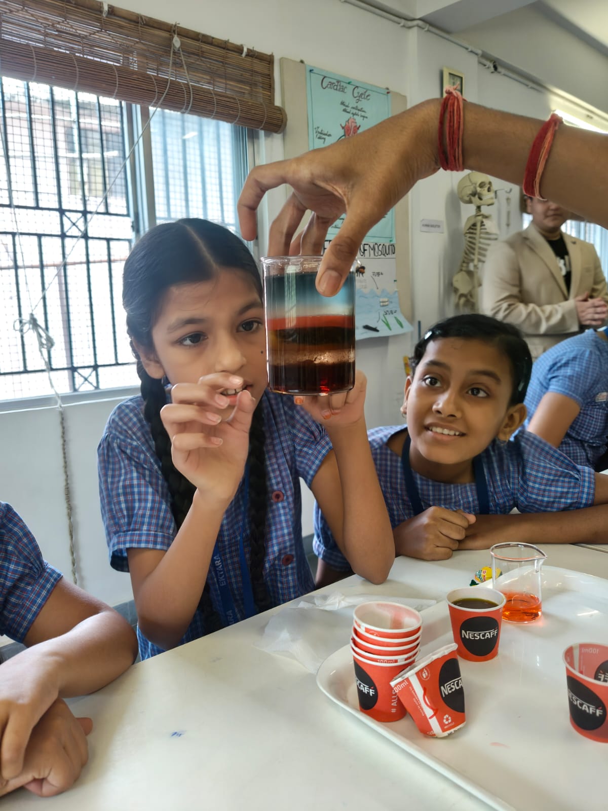 Students with paper recycling materials