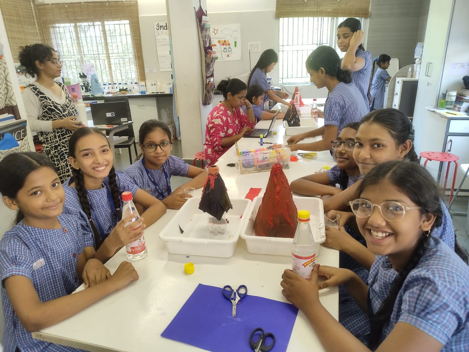 Students observing a density tower experiment